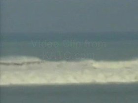 Wave hitting Khao-Lak and man on beach.wmv.webm
